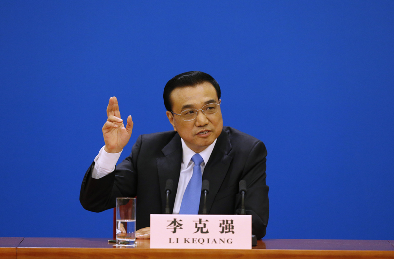 3月15日，國務(wù)院總理李克強在北京人民大會堂與中外記者見面，并回答記者提問。 新華社記者 沈伯韓 攝